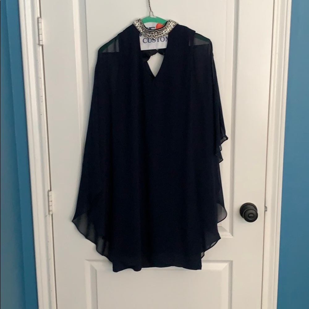 A knee length, navy blue dress.